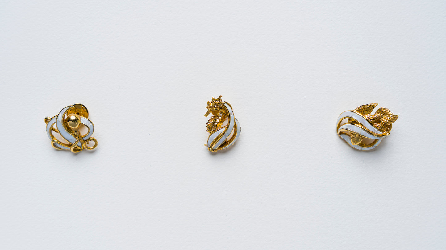Triton's Brooches in White Cabebe Shell