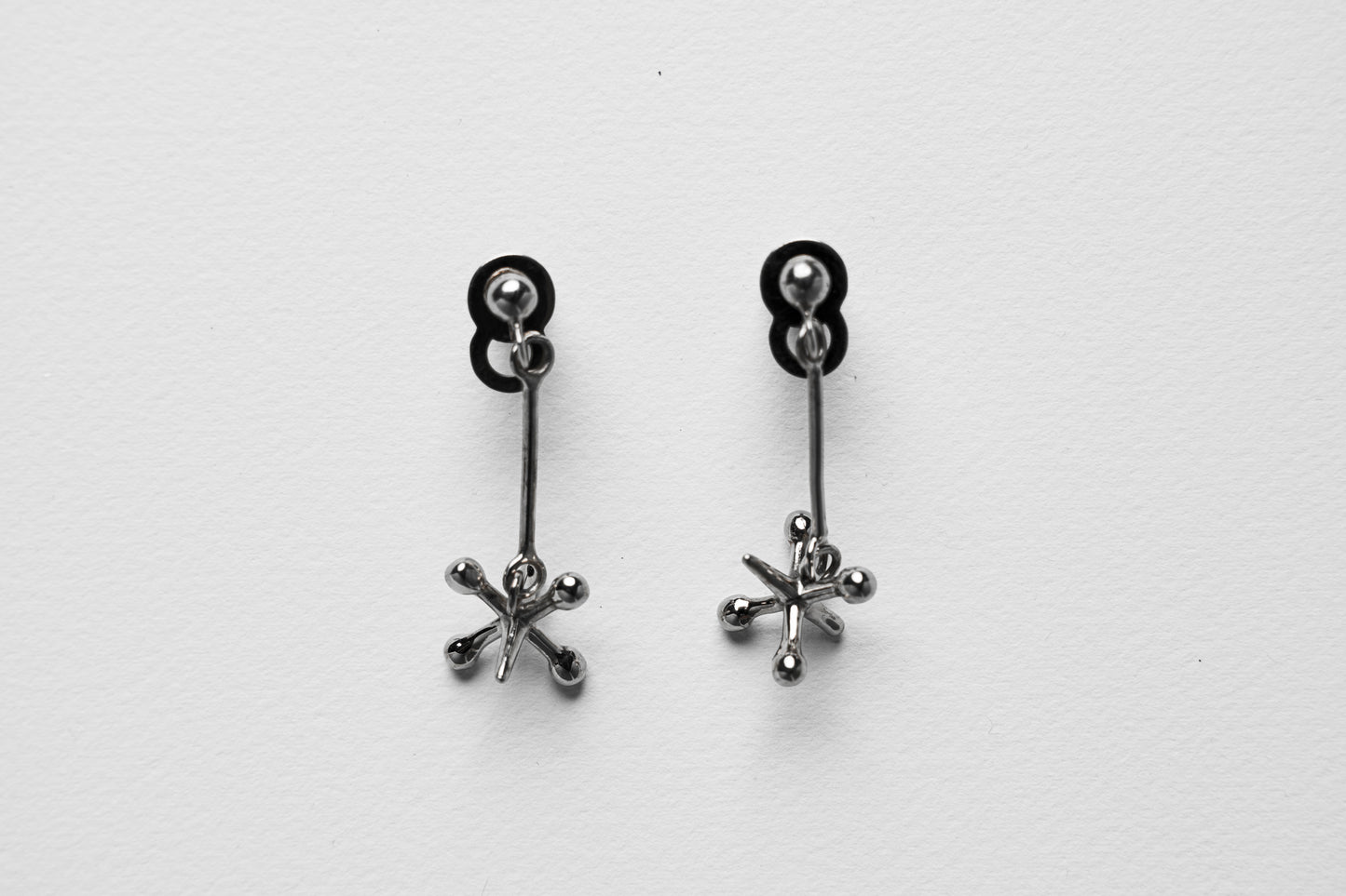 Jackstone Dangling Earrings plated in Silver