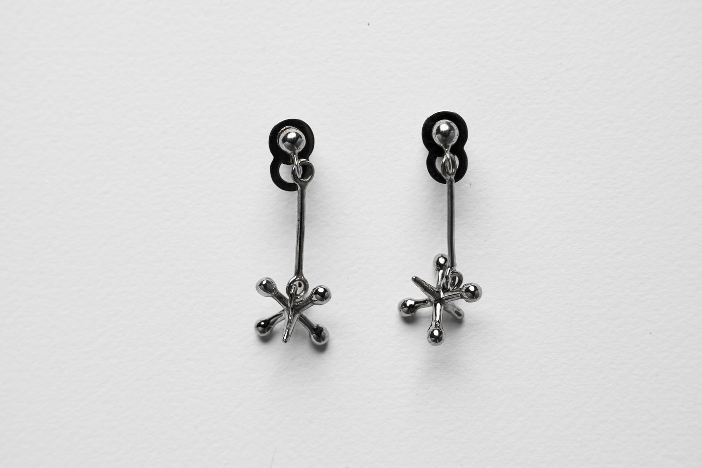 Jackstone Dangling Earrings plated in Silver
