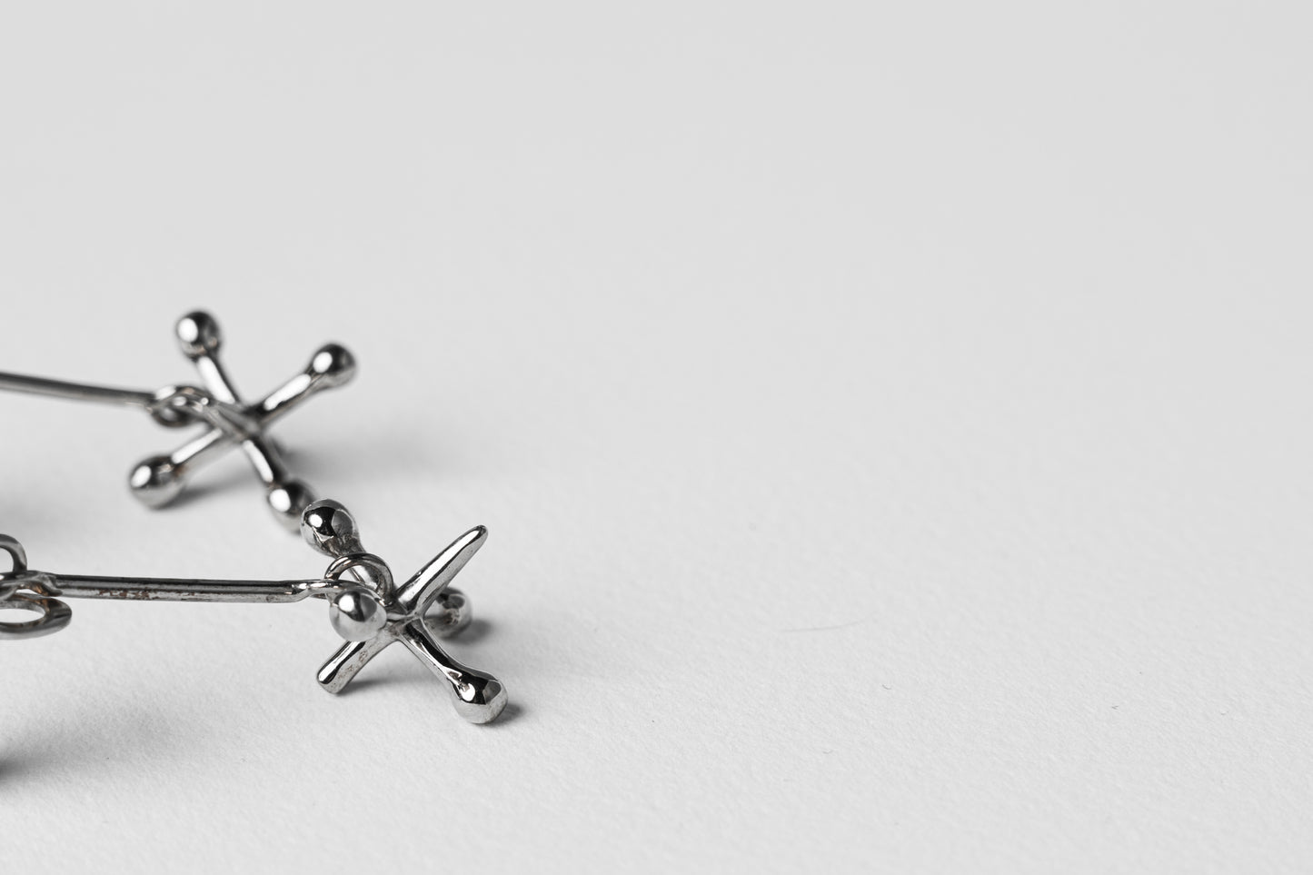 Jackstone Dangling Earrings plated in Silver