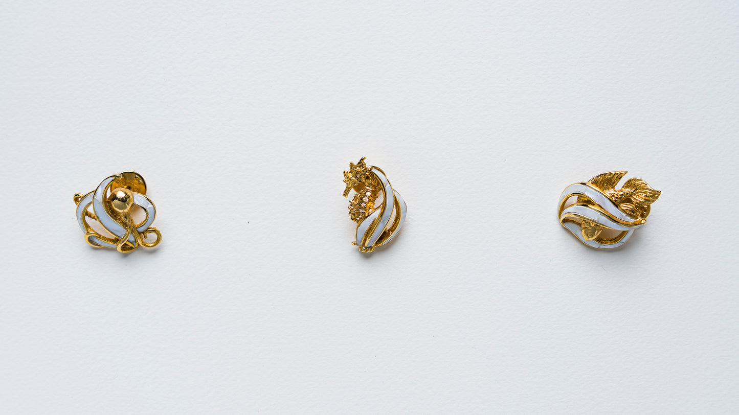 Triton's Brooches in White Cabebe Shell